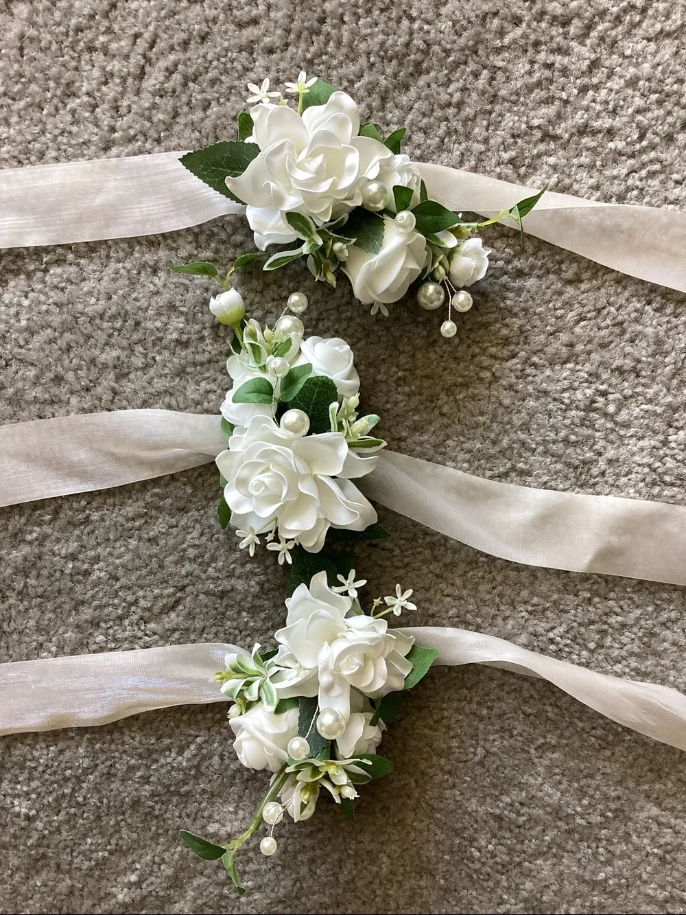 White Floral Wrist Corsage with Ribbon Tie - 2 corsages are new and 1 was used.